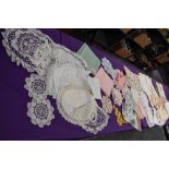 An assortment of vintage table linen, some embroidered items,linen examples included.