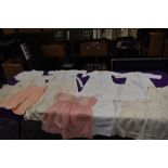 A mixed lot of vintage and antique babies clothing.