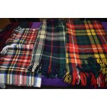 A collection of vintage tartan rugs.