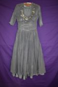 A 1940s grey dress with beading and sequins to bust.AF