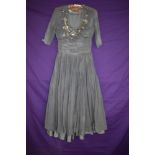 A 1940s grey dress with beading and sequins to bust.AF