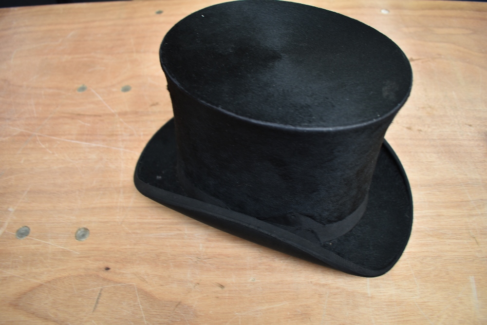 An antique top hat 'R.W.T.K Thompson Kendal' internal measurement approx 21' height approx 6',some