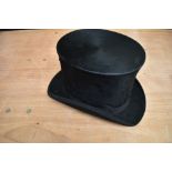 An antique top hat 'R.W.T.K Thompson Kendal' internal measurement approx 21' height approx 6',some