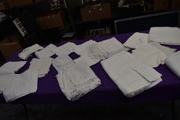 A selection of vintage and antique table linen including damask and some with crotchet and tatting