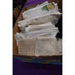 A collection of vintage and antique table linen including crotchet work and embroidered items.