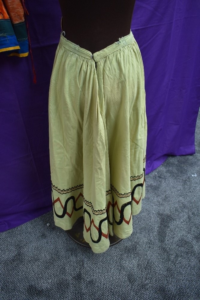 An early 20th century lime green skirt with embroidered detailing and bright vintage ethnic skirt. - Image 2 of 3