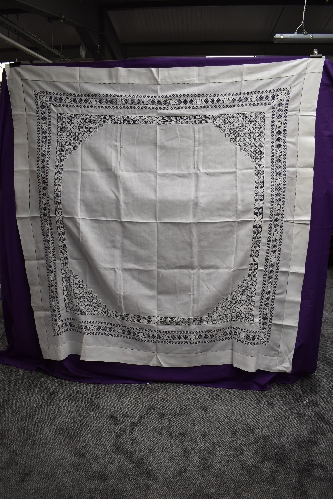 A large antique table cloth.