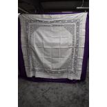 A large antique table cloth.