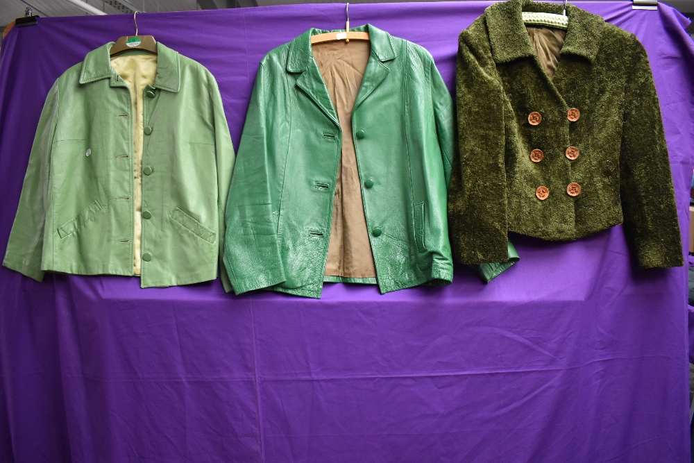 Two vintage green ladies leather jackets and a green coat.