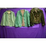 Two vintage green ladies leather jackets and a green coat.