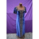 A 1920s/30s blue velvet dress having extensive metal thread work and sequins throughout.
