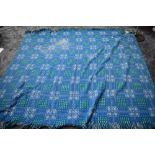 A blue,white and green Welsh wool blanket 'A dyffryn product,Cymryu am Byth'.