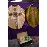 A case of richly decorated antique priests garments.
