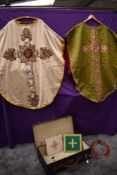 A case of richly decorated antique priests garments.