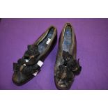 A pair of Victorian Childrens shoes with bow and beading detail to fronts.