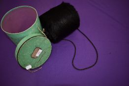 An antique beaver fur muff in original Parisian box.