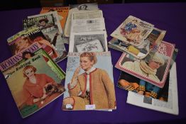 A collection of vintage knitting magazines.