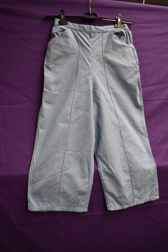 A pair of 1950s American powder blue linen ladies pedal pushers or cropped trousers having side