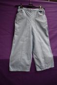 A pair of 1950s American powder blue linen ladies pedal pushers or cropped trousers having side