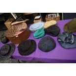 A hat case containing assorted vintage hats, 1940s to late 60s/early 70s.
