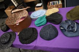 A hat case containing assorted vintage hats, 1940s to late 60s/early 70s.