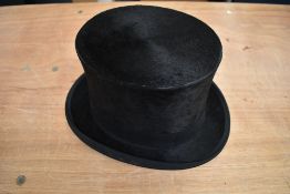 An antique top hat 'R.W.T.K Thompson Kendal' internal measurement approx 21' height approx 5.5',some