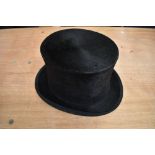 An antique top hat 'R.W.T.K Thompson Kendal' internal measurement approx 21' height approx 5.5',some