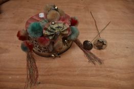 A vintage oriental cap with pom poms,bells, and metallic embroidery with mirrors, also included