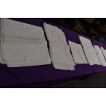 Seven antique damask table cloths.