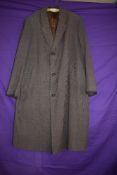 A vintage gents wool/wool blend overcoat having vent to back and pockets to front.