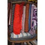 A box full of vintage upholstery fabrics, leatherette and more, some large pieces.