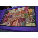 A vintage panel or sampler using panels of various fabrics with embroidery,sequins, braid work and