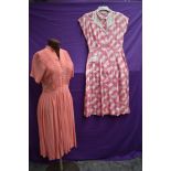 Two 1940s day dresses, one having honeycomb smocking to front the other with white lattice