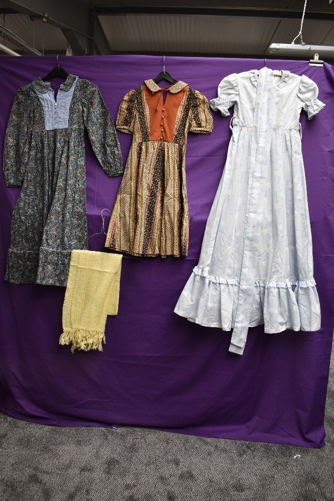 A collection of childrens vintage dresses.