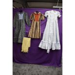 A collection of childrens vintage dresses.