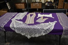 A lot containing sections and panels of lace, tulle and similar most appear to have been removed