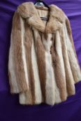 A ladies vintage fur coat having contrasting panels.