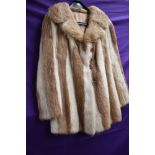 A ladies vintage fur coat having contrasting panels.