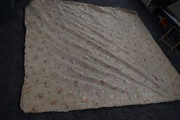 An early 20th century satin quilt with floral design of champagne ground having soutache type thread