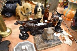 A selection of vintage dog related collectables including wall mounted spaniel and metal spaniel pin