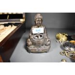 A Chinese style incense burner in the form of a seated Buddha