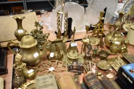 A selection of brass wares including kettles, candle stick and figures