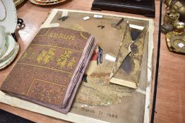 A Victorian embroidery dated 1848 and a book containing lace work, needle work and similar