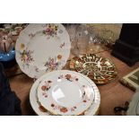 A selection of dinner and display plates including Royal Crown Derby graduated Imari