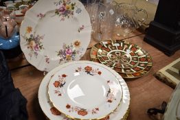 A selection of dinner and display plates including Royal Crown Derby graduated Imari