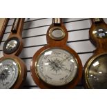 A late Victorian barometer of banjo form with metal face dial for Sedburgh