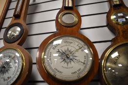 A late Victorian barometer of banjo form with metal face dial for Sedburgh