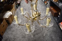 A six branch ceiling light candelabra style having lustre droplets and cut form