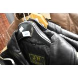 A vintage motor cycle jacket and similar waist coat