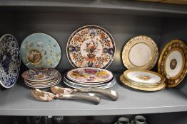 A selection of ceramic plates including Chinese style and hand decorated with cottage scene